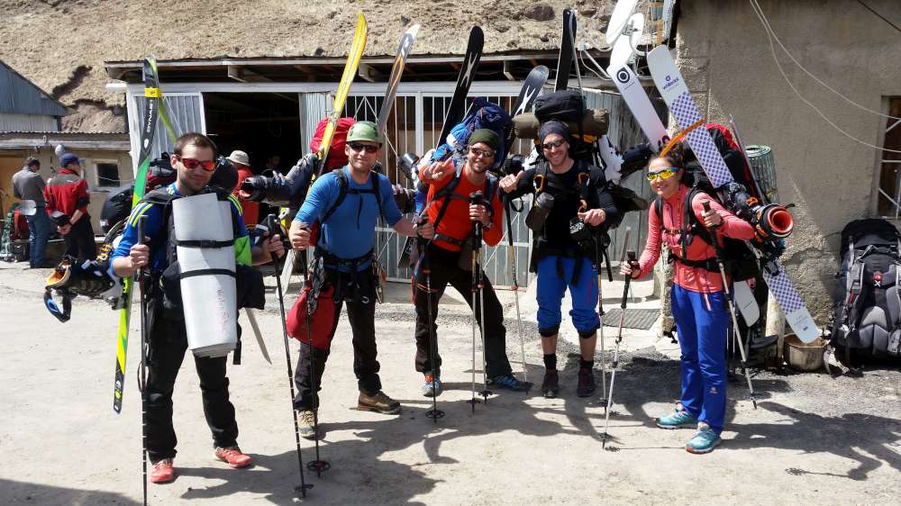 Elbrus expedition team with skis and rucksacks ready to set off