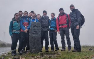 A 3 national 3 peaks group heading up to Snowdon summit