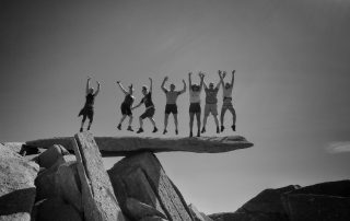 Group jumping on the Cantilever Stone in the Glyderau, Snowdonia