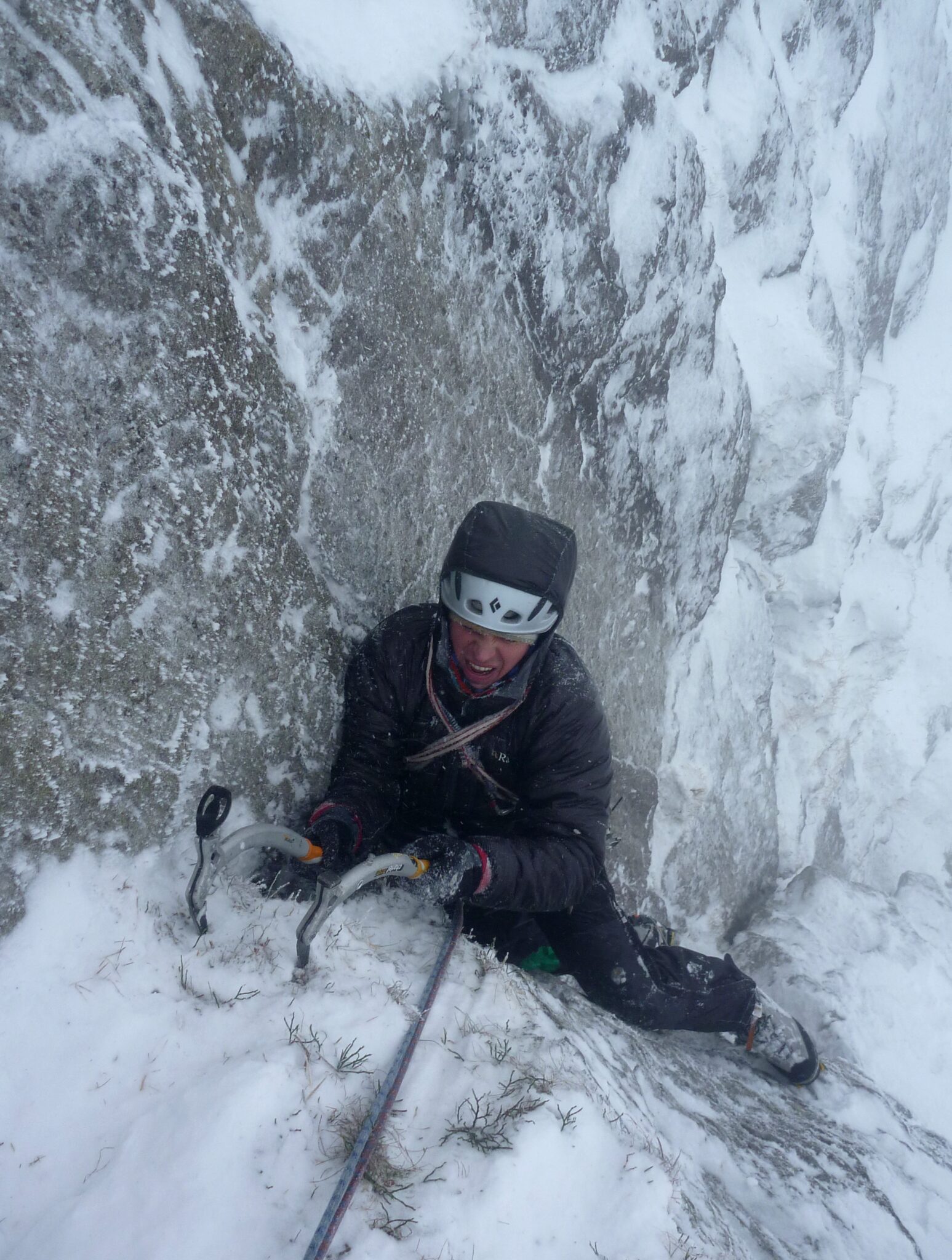 Dave Talbot climbing a snowy winter gully with two ice axes