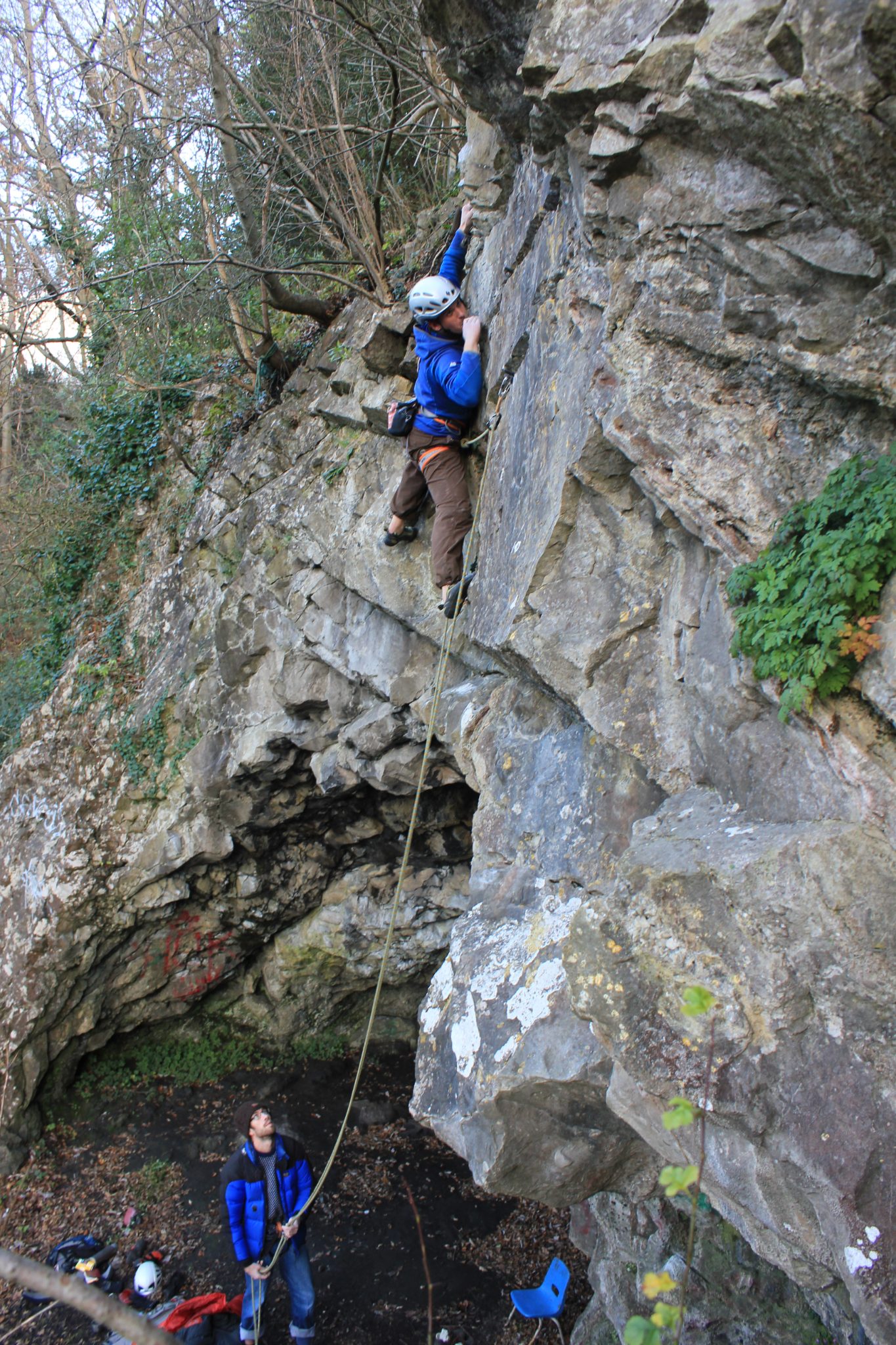 Climber on a new route up a tall limestone face in the Avon Gorge